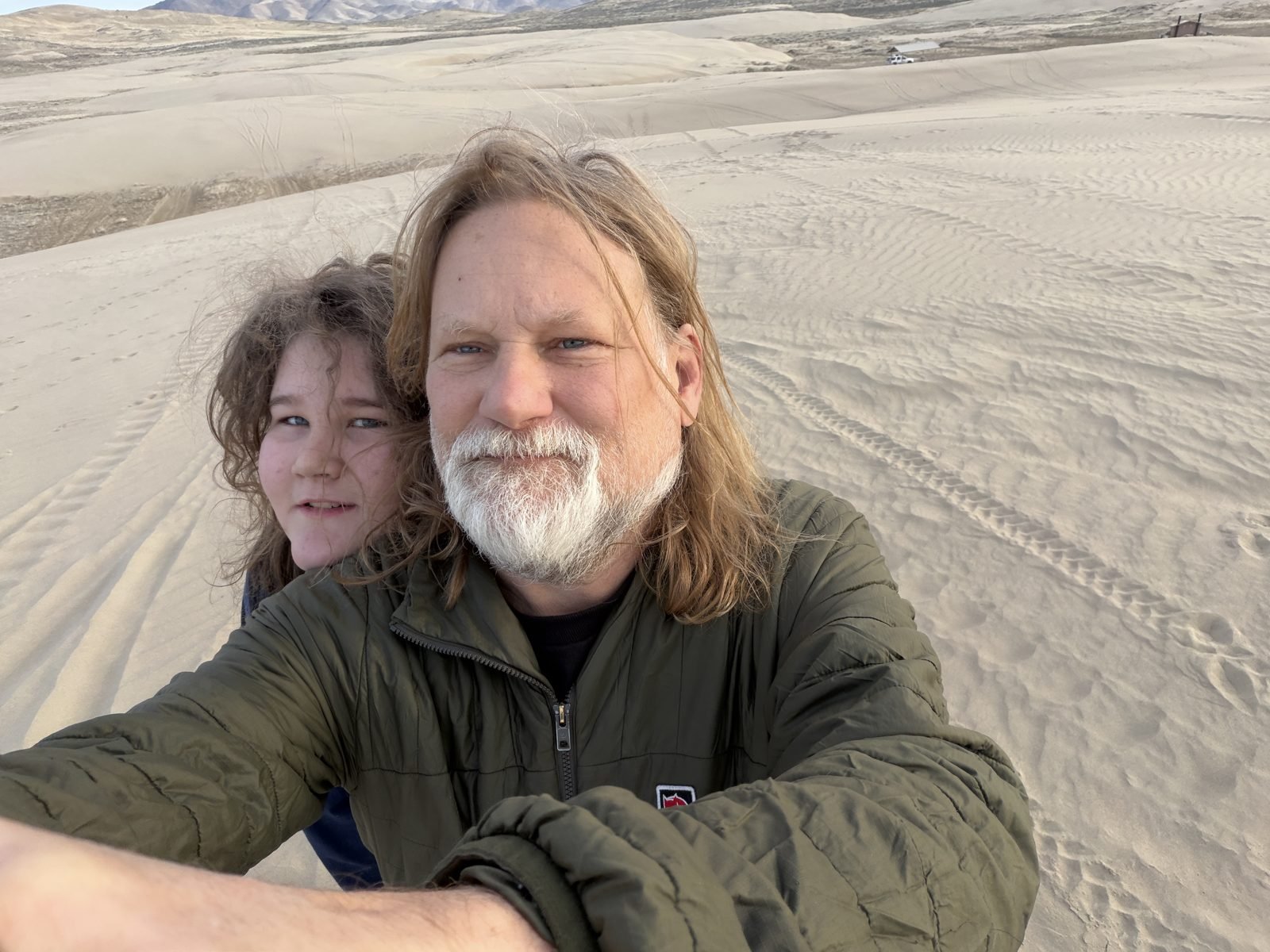 Selfie in the sand dunes on a road trip