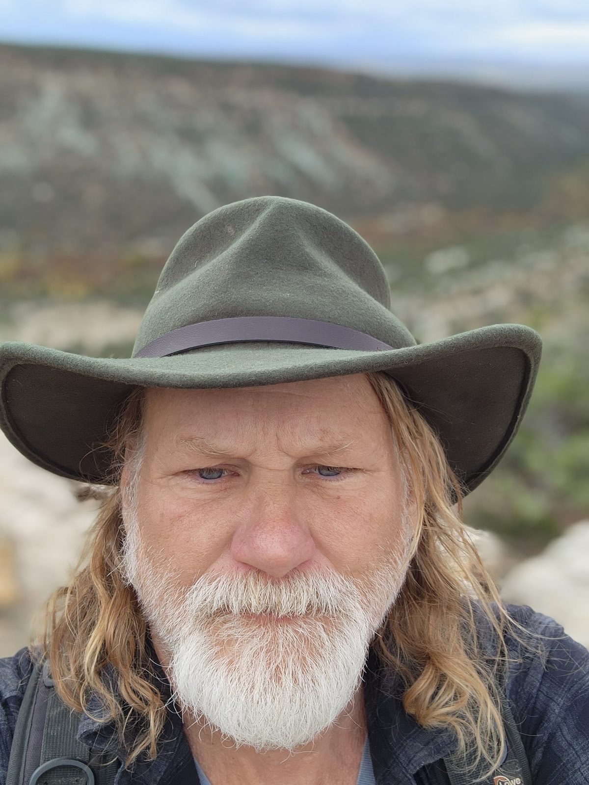 Rockhound in a wide-brimmed hat outdoors